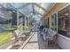 Relaxing screened patio with brick flooring and seating at 7425 Nature Walk Dr, Spring Hill, FL 34606