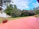 Large backyard with patio and lush greenery at 7805 Radcliffe Cir # 7805, Port Richey, FL 34668