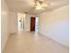 Spacious bedroom with tile floors and ceiling fan at 7805 Radcliffe Cir # 7805, Port Richey, FL 34668
