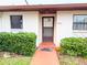 Front entrance with a walkway and landscaping at 7805 Radcliffe Cir # 7805, Port Richey, FL 34668