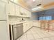 White kitchen with stainless steel appliances at 7805 Radcliffe Cir # 7805, Port Richey, FL 34668