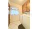 Laundry room with washer, dryer, and cabinets at 7805 Radcliffe Cir # 7805, Port Richey, FL 34668