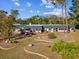 Single-story home with a large yard and mature trees at 7815 Tanglewood Dr, New Port Richey, FL 34654