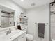 Clean bathroom with white vanity, shower, and bathtub at 7815 Tanglewood Dr, New Port Richey, FL 34654