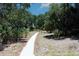 Paved nature trail winding through lush, natural landscape at 10017 Zennia Ln, Parrish, FL 34219