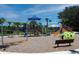 Community playground with swings and play structures at 10017 Zennia Ln, Parrish, FL 34219