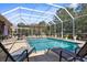 Large, screened pool with plenty of patio space for relaxing at 10124 Southern Breeze Ct, Weeki Wachee, FL 34613