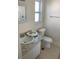 Clean bathroom with single vanity and shower/tub combo at 10929 Premier Ave, Port Richey, FL 34668