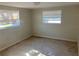 Bright bedroom with neutral walls and carpet at 10929 Premier Ave, Port Richey, FL 34668