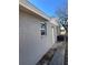Gray house exterior with landscaping at 10929 Premier Ave, Port Richey, FL 34668