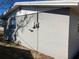 Side of gray house with window at 10929 Premier Ave, Port Richey, FL 34668