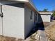 Side of gray house with walkway at 10929 Premier Ave, Port Richey, FL 34668