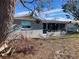 Rear view of house with screened porch at 10929 Premier Ave, Port Richey, FL 34668