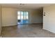 Spacious living room with sliding glass doors and carpet at 10929 Premier Ave, Port Richey, FL 34668