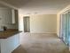Open living area with access to kitchen and patio at 10929 Premier Ave, Port Richey, FL 34668