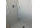 Shower stall with tiled walls and built-in shelving at 10929 Premier Ave, Port Richey, FL 34668