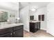 Double vanity bathroom with granite countertop and large mirror at 11169 Jackdaw Rd, Weeki Wachee, FL 34614