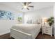 Bright bedroom with ceiling fan and comfortable bed at 11169 Jackdaw Rd, Weeki Wachee, FL 34614