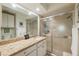 Clean bathroom with granite countertops, a shower/tub combo, and updated fixtures at 11445 Orleans Ln, Port Richey, FL 34668