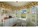 Charming breakfast nook with a view of the backyard at 11445 Orleans Ln, Port Richey, FL 34668
