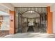 Ornate entrance with iron gate leading to the community's main building at 11445 Orleans Ln, Port Richey, FL 34668