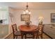 Bright dining area with a view into the kitchen and living room at 11445 Orleans Ln, Port Richey, FL 34668