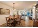 Round dining table with four chairs, situated near the kitchen at 11445 Orleans Ln, Port Richey, FL 34668