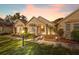 Well-maintained villa with attractive landscaping and exterior lighting at 11445 Orleans Ln, Port Richey, FL 34668
