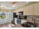 Eat-in kitchen with ample cabinet space and a view to the backyard at 11445 Orleans Ln, Port Richey, FL 34668