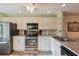 Bright kitchen featuring granite countertops and modern appliances at 11445 Orleans Ln, Port Richey, FL 34668