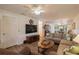 Bright living room with ample seating, hardwood floors, and views into other rooms at 11445 Orleans Ln, Port Richey, FL 34668