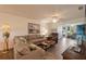 Spacious living room with a comfortable sectional sofa and wood floors at 11445 Orleans Ln, Port Richey, FL 34668