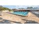 Inviting community swimming pool with plenty of lounge chairs at 11445 Orleans Ln, Port Richey, FL 34668