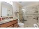 Elegant bathroom with granite vanity and large shower at 11526 White Ash Dr, New Port Richey, FL 34654