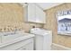 Laundry room with washer, dryer, and sink at 14017 Spring Hill Dr, Spring Hill, FL 34609