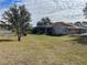 Large backyard with spacious lawn and shed at 15131 Eastwood Trl, Brooksville, FL 34604