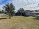 Large backyard with spacious lawn and shed at 15131 Eastwood Trl, Brooksville, FL 34604