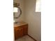 Bathroom with vanity, sink, and decorative mirror at 15131 Eastwood Trl, Brooksville, FL 34604