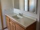 Clean bathroom vanity with wood cabinets and a large countertop at 15131 Eastwood Trl, Brooksville, FL 34604