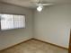 Simple bedroom with tiled floor and ceiling fan at 15131 Eastwood Trl, Brooksville, FL 34604