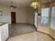 Spacious dining area with tile flooring and access to other rooms at 15131 Eastwood Trl, Brooksville, FL 34604