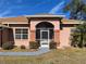 Brick house with brown roof and screened porch at 15131 Eastwood Trl, Brooksville, FL 34604