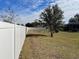 White vinyl fence providing privacy at 15131 Eastwood Trl, Brooksville, FL 34604