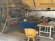 Well-lit workshop with various tools and workbenches at 15131 Eastwood Trl, Brooksville, FL 34604