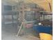 Lofted workshop with built-in shelving and workbench at 15131 Eastwood Trl, Brooksville, FL 34604
