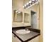 Bathroom with vanity, sink, and large mirror at 2199 Chianti Pl # 9-0917, Palm Harbor, FL 34683