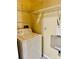 Laundry room with washer, dryer, and extra shelving at 2199 Chianti Pl # 9-0917, Palm Harbor, FL 34683