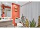 Bathroom with cactus-themed shower curtain and updated vanity at 2595 Royal Liverpool Dr, Tarpon Springs, FL 34688