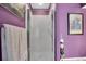 Small purple bathroom with shower stall at 2595 Royal Liverpool Dr, Tarpon Springs, FL 34688