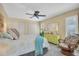 Bright bedroom featuring a queen-size bed and ample closet space at 2595 Royal Liverpool Dr, Tarpon Springs, FL 34688